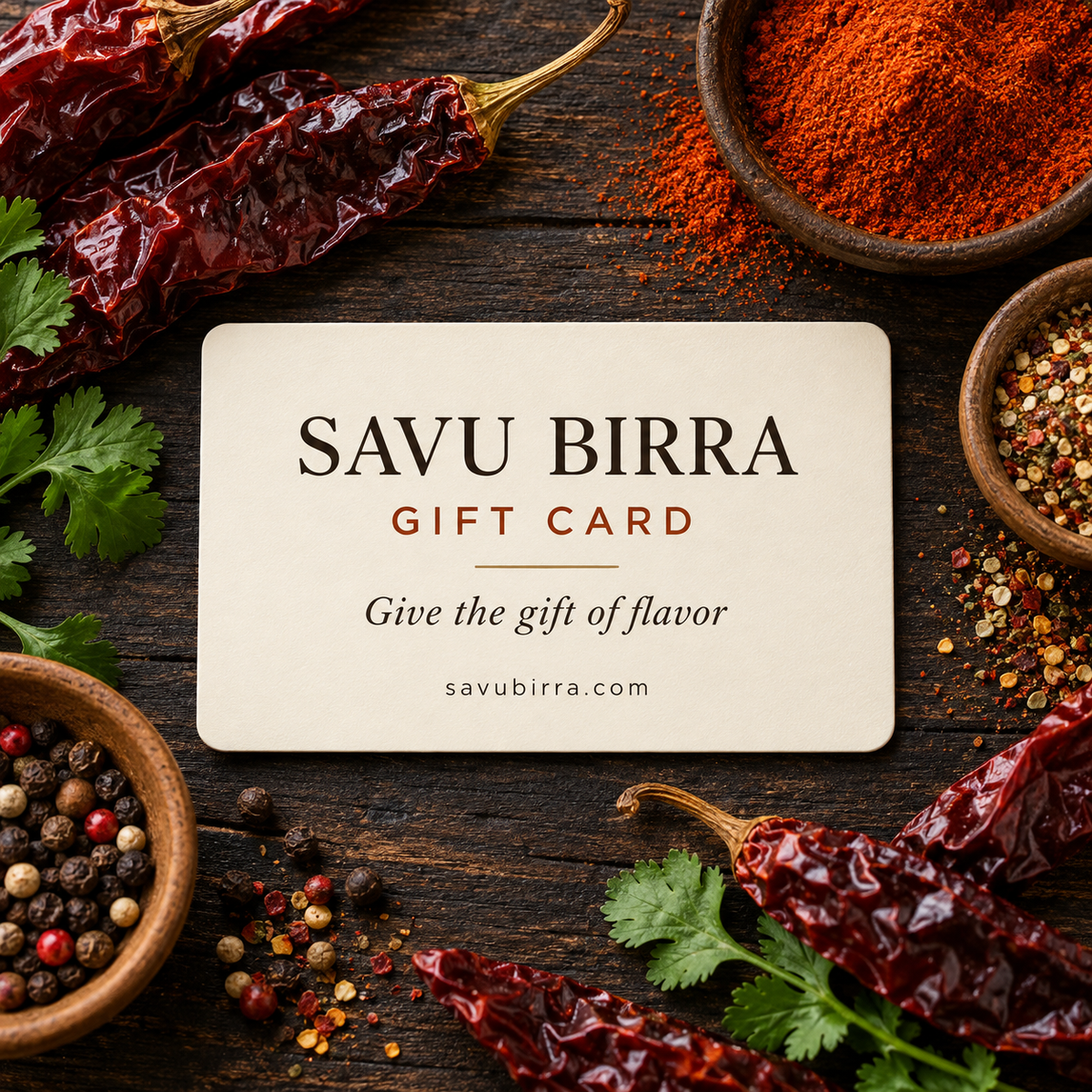 Savu Birra digital gift card surrounded by dried chile peppers and seasonings — Give the gift of flavor